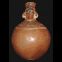 Hominoid orange ware terracotta vessel